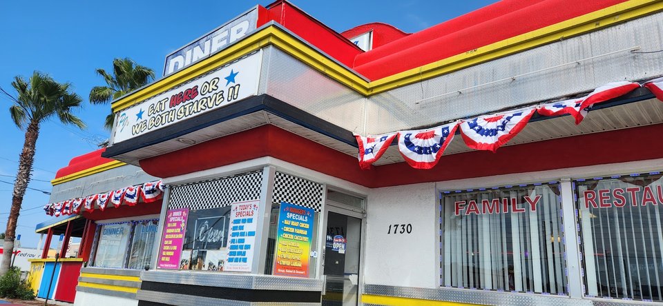 Classic diner booths with checkered flooring.