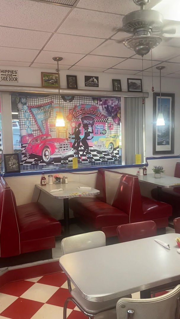 Classic diner booths with checkered flooring.